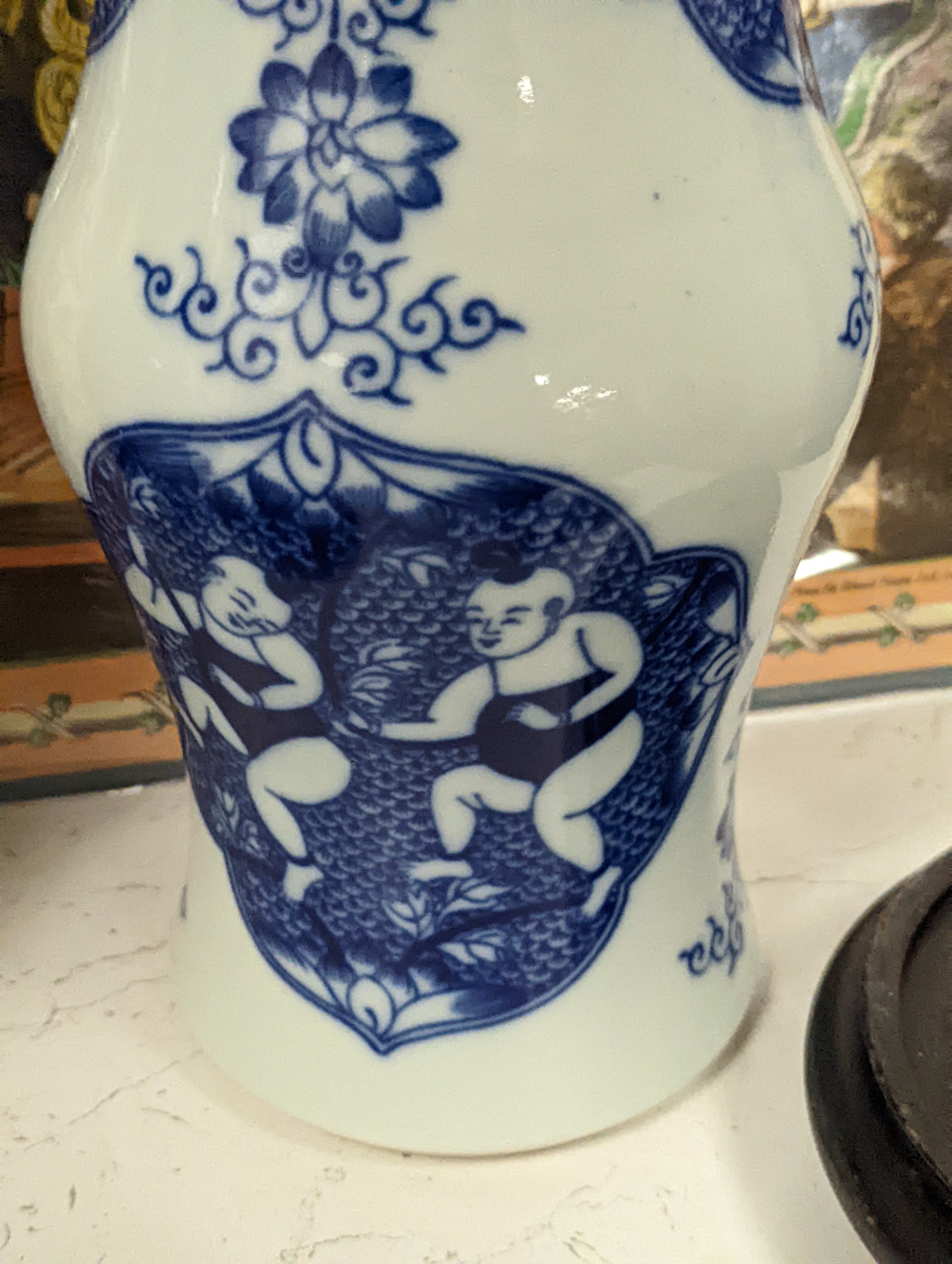 A pair of Chinese blue and white vases on stands and 6 further wood stands. Vases 35cm